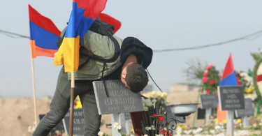 Brother's sorrow at an Armenian Cemetery